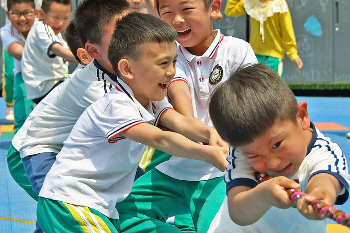 Allowing couples in China to have up to three children rather than two will help the country counteract a population that's shifting towards the elderly, the government says.