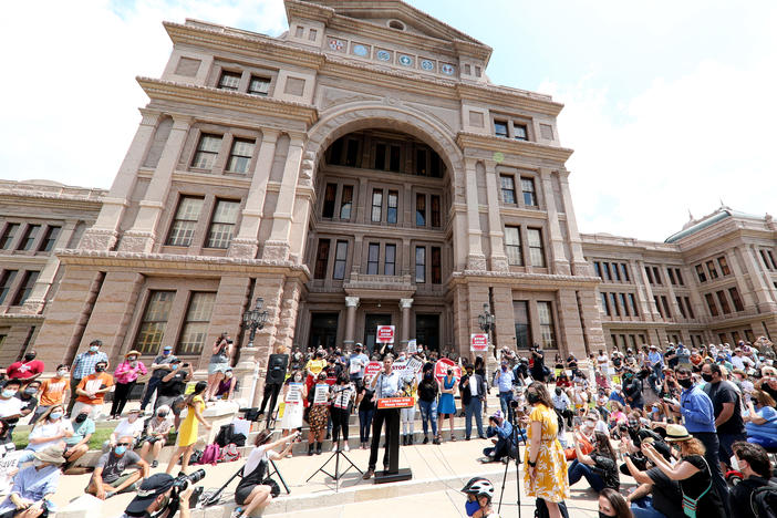 "This is a preventative measure for us," state Rep. Travis Clardy says of the Republican-backed Senate Bill 7, which sought to tighten voting rules, citing a need to prevent fraud. Here, opponents of the bill hold a rally last month at the Texas Capitol in Austin.
