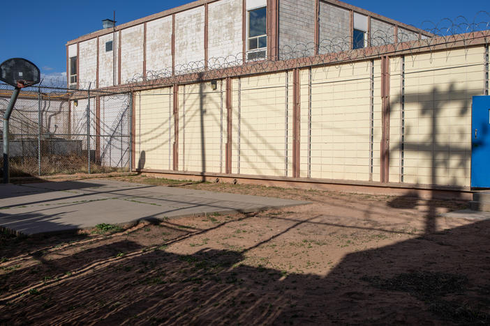 Correctional officer Hansen Attakai looks out at the Window Rock District Department of Corrections in Window Rock, Ariz., on the Navajo Nation.<strong> </strong>