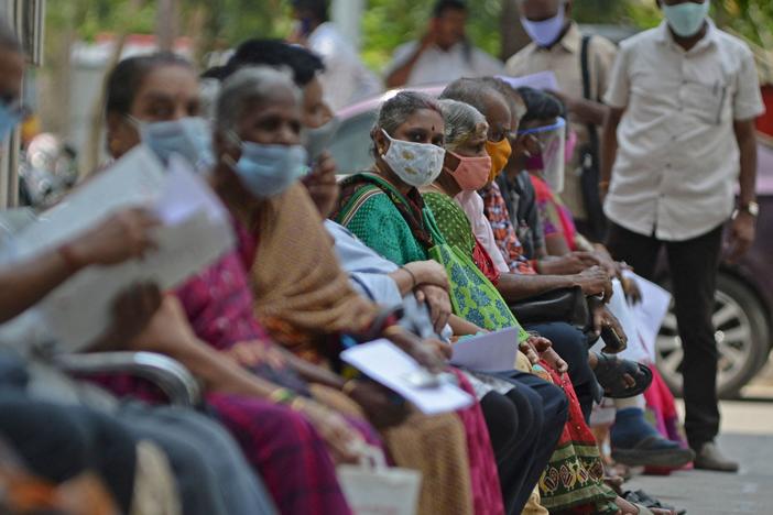 People wait their turn to receive the COVID-19 vaccine at a hospital in Chennai, India, in April. India is among the nations that will receive surplus U.S. vaccine through the international distribution system COVAX, the White House announced.