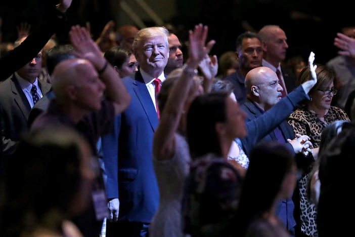Donald Trump attends a worship service in Las Vegas when he was a presidential candidate in 2016. Trump won over many white conservative Christians by wrapping their traditional priorities in with his own particular cultural fixations.