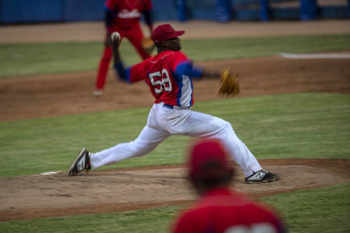 Cuba's pitcher Yoanni Yera Montalvo throws the ball during a training session at the Estadio Latinoamericano in Havana last month. Cuba's losses this week in Florida to Venezuela and Canada in Olympic baseball qualifying play means the team will not compete in the Summer Games.
