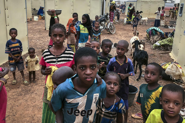 Children of about 6,000 ethnic Fulanis who have been displaced by attacks gather in a makeshift camp in Youba, Burkina Faso, in April 2020. The West African nation continues to be racked by violence linked to Islamic extremists and local defense militias.