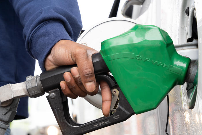 A man refuels at a gas station last month in Fayetteville, N.C., during a period when a hacking attack shut down a key pipeline. Oil companies confront an uncertain future, facing pressure to move toward greener energy.