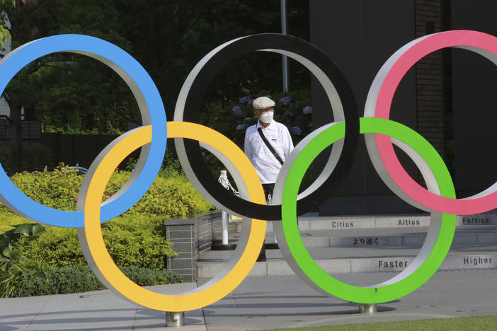 The International Olympic Committee plans to implement strict virus-prevention measures that include segregation of athletes from the general population and a ban on overseas fans.