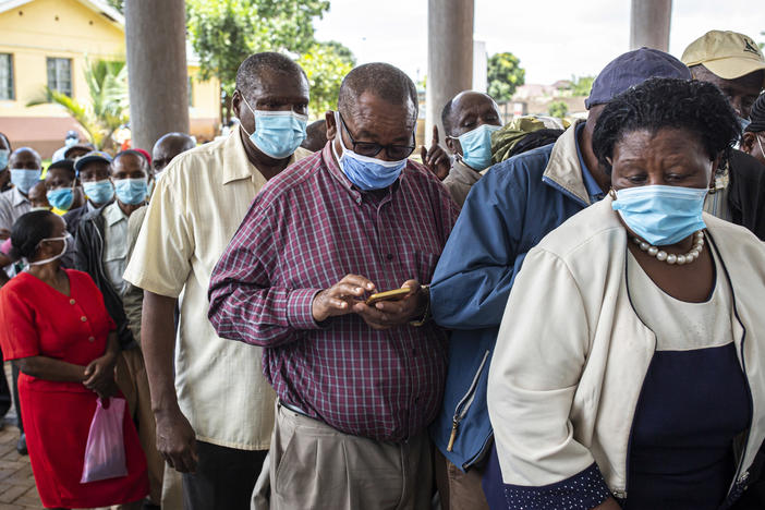 Vaccine doses are in short supply in African countries — and even when they arrive, there may not be a way to get them into people's arms in a timely fashion. Above: People wait to get vaccinated at a hospital in Thika, Kenya, in March.