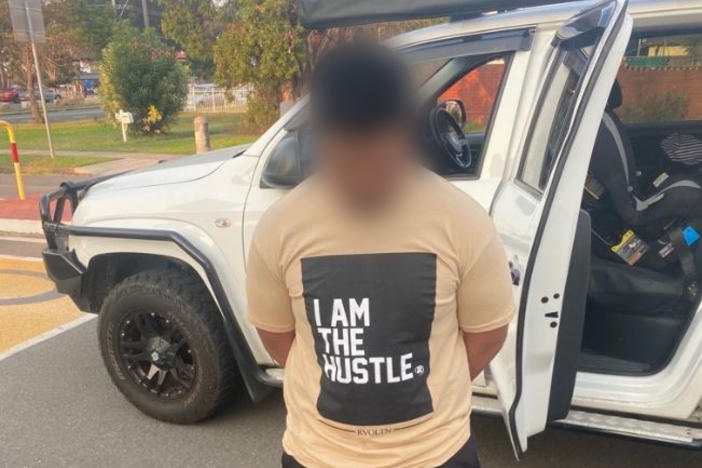 A man was arrested in an international sting operation targeting drug smugglers. Australian Federal Police blurred the suspect's face due to privacy concerns.