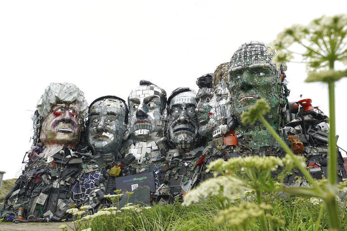 A sculpture created out of electronic waste in the likeness of Mount Rushmore and the G-7 leaders sits on a hill in Cornwall, England, near where the leaders of the world's wealthiest nations will meet.