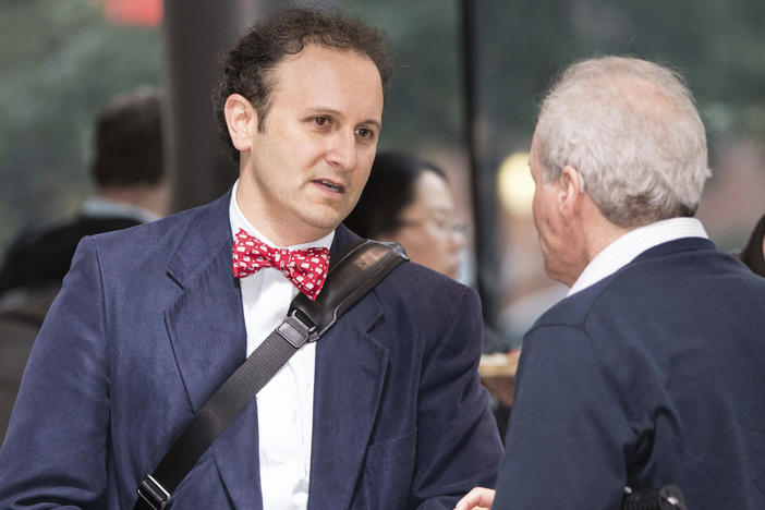 Dr. Aaron Kesselheim (left), a professor at Harvard Medical School, at a documentary film screening in 2018 in Boston. He has resigned from a Food and Drug Administration advisory panel over the FDA's decision to approve an Alzheimer's drug.