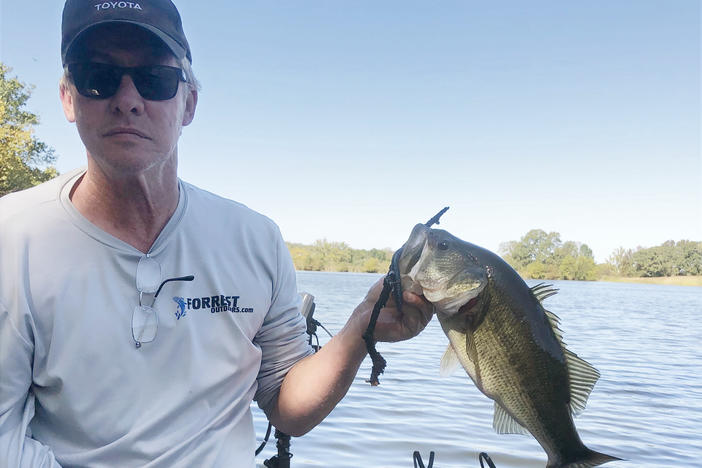 Mark Forrest is back fishing after rehabilitation with the IpsiHand device helped him regain use of his right hand.