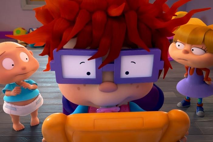 Pictured: Tommy Dewey as Stu Pickles, Nancy Cartwright as Chuckie Finster and Cheryl Chase as Anjelica Pickles of the Paramount+ series <em>Rugrats</em>.