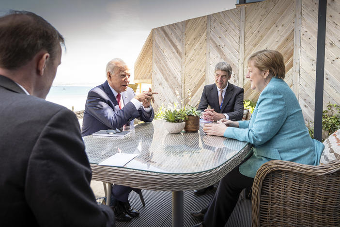 President Biden meets with German Chancellor Angela Merkel on the sidelines of the G-7 summit. A White House official said Biden did a lot of "diplomatic speed-dating" with world leaders.
