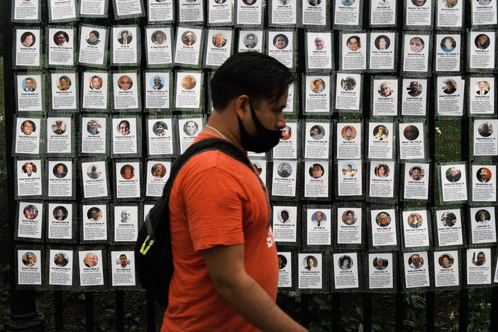 Memorials hang from the front gate of Greenwood Cemetery in New York City during an event organized by Naming the Lost Memorials to remember and celebrate those who died during the COVID-19 pandemic.