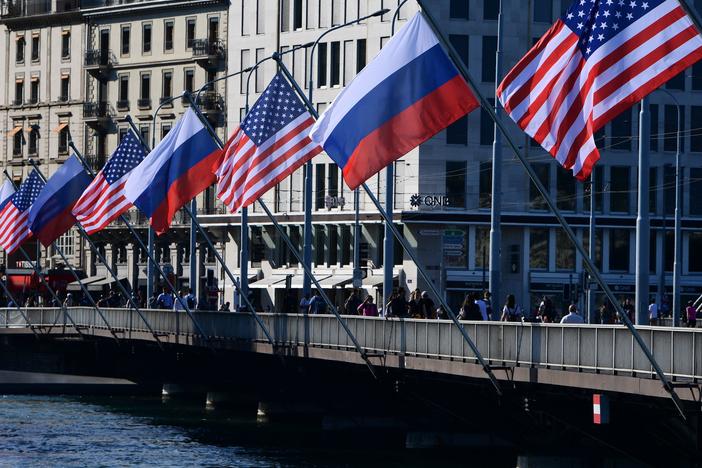 U.S. and Russian flags fly on the Mont-Blanc bridge on the eve of a US-Russia summit on Tuesday in Geneva. A former intelligence operative says agencies are in high gear.