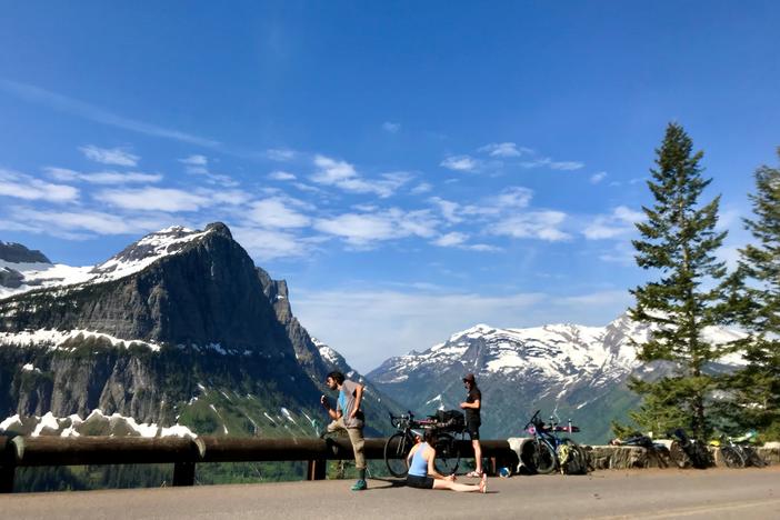 Cyclists take a break on Glacier National Park's Going-To-The Sun road.