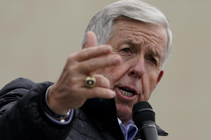 Missouri Gov. Mike Parson speaks at a campaign rally at a gun store in October in Lee's Summit, Mo. Parson has signed into law a measure that could fine state and local law enforcement officers $50,000 for helping to enforce federal gun laws.