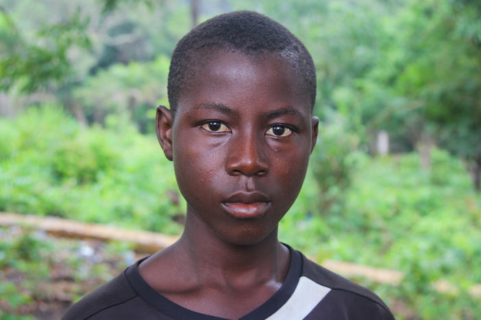 Sahr Tarawaly, 14, works several jobs to earn money to support his mom and two siblings. "I used to like mathematics," the round-faced teenager says. "Now I go down to the beach to fish, to have fish to eat."