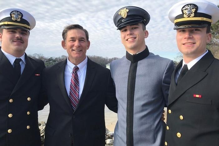 Jeff Nelligan (center left) stands with his three sons in December 2019.