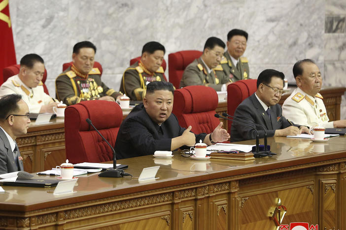 In this photo provided by the North Korean government, North Korean leader Kim Jong Un, center, speaks during a Workers' Party meeting Thursday in Pyongyang. Kim ordered his government to be fully prepared for confrontation with the Biden administration, state media reported Friday, days after the U.S. and other major powers urged the North to abandon its nuclear program and return to talks.