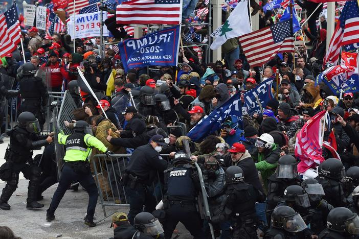 Rioters clash with police as they push barricades to storm the U.S. Capitol on Jan. 6, 2021.