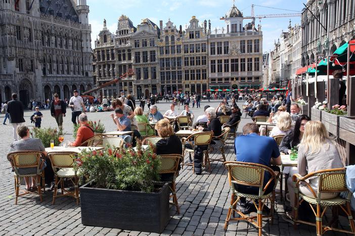 People enjoy the May sunshine from the cafe terraces of Brussels' Grand Place. On Friday, European Union added the United States to the list of countries whose citizens and residents should be allowed to travel freely within the bloc.