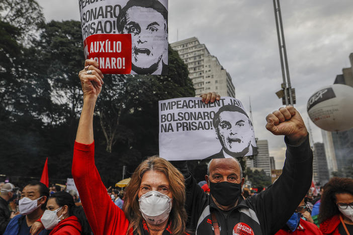 Demonstrators hold signs that read in Portuguese: "Impeachment now! Bolsonaro in prison" during a protest against Brazilian President Jair Bolsonaro and his handling of the COVID-19 pandemic, in Sao Paulo, Brazil, on Saturday.