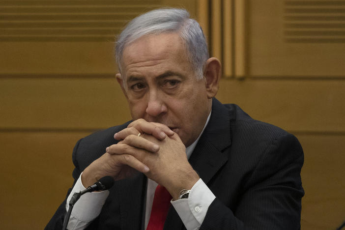 Former Israeli Prime Minister Benjamin Netanyahu speaks to right-wing opposition party members a day after a new government was sworn in, at the Knesset, Israel's parliament, in Jerusalem, Monday, June 14, 2021.