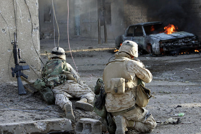 U.S. Marines take cover as they push into the center of Fallujah, Iraq, in November 2004. The battle for the city produced the heaviest urban fighting of the Iraq war.