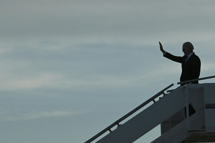 President Biden waves as he prepares to depart the airport after meeting with Russian President Vladimir Putin in Geneva, on June 16.