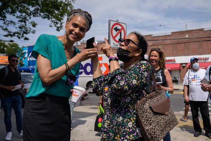 New York mayoral candidate Maya Wiley greets voters in the East Flatbush area of Brooklyn. New Yorkers are voting in primary elections Tuesday, after a closely watched race.