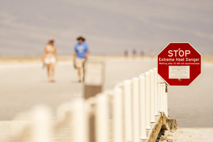 A sign warns of extreme heat danger last week at the Badwater Basin in Death Valley, Calif.