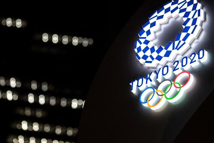 The Tokyo 2020 Olympic Games logo is pictured outside the Tokyo station in Tokyo on June 22.