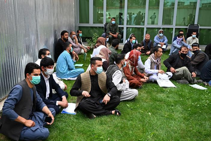Former interpreters for U.S. and NATO forces gather during a demonstration in downtown Kabul, Afghanistan, on April 30, on the eve of the beginning of Washington's troop withdrawal.