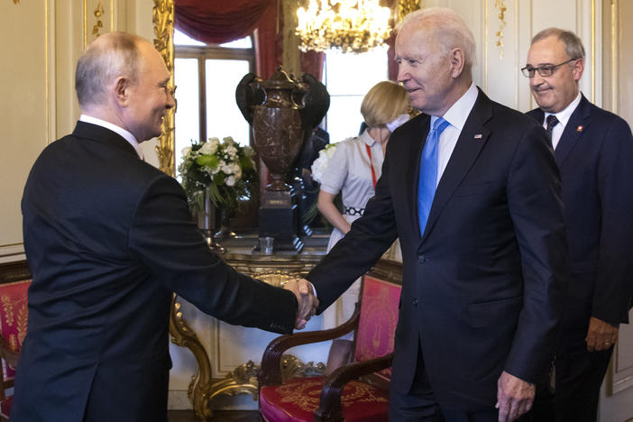 U.S. President Biden and Russian President Vladimir Putin shake hands as Swiss President Guy Parmelin (right) looks on during the U.S.-Russia summit at Villa La Grange on June 16 in Geneva, Switzerland.