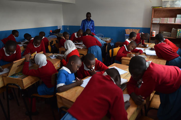 Students work on a classroom exercise at a school in Kibera, a poor neighborhood in Nairobi, Kenya.