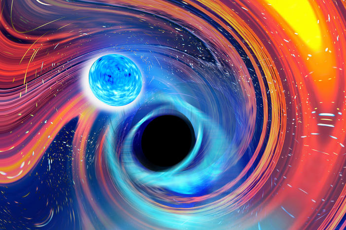 An artistic image of what happens when a monstrous black hole collides with — and gulps down — a neutron star the size of a large city.