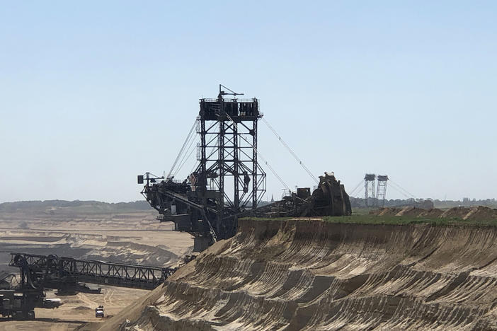 The Bagger 288, a bucket-wheel excavator, digs into the beet fields behind the farm of Norbert Winzen to expand Germany's Garzweiler coal mine, one of Europe's largest open-pit mines. Winzen's family is fighting coal mine operator RWE in an effort to save their village of Keyenberg, which is more than a thousand years old.