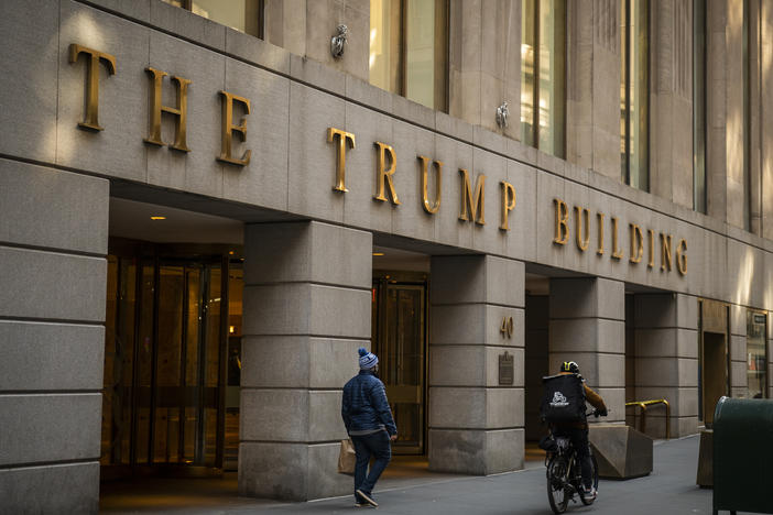 A pedestrian walks past the Trump Building in New York City in January.