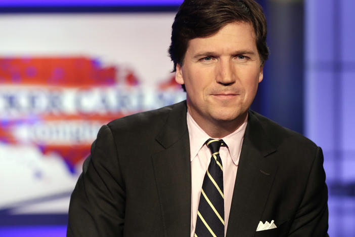 Tucker Carlson, host of <em>Tucker Carlson Tonight</em>, on the set of his Fox News program in 2017.