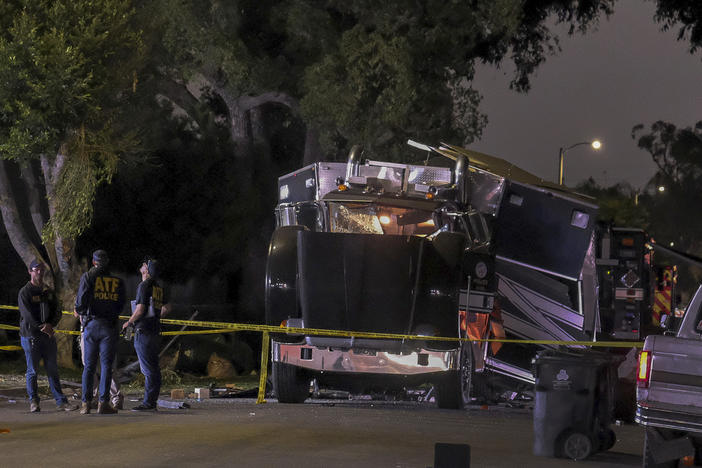 A cache of 5,000 pounds of illegal fireworks seized at a South Los Angeles home exploded and destroyed an armored Los Angeles Police Department tractor-trailer, damaging nearby homes and cars and causing injuries, authorities said.