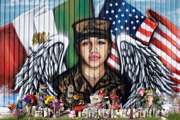 Candles and flowers decorate a makeshift memorial for Vanessa Guillén, a Fort Hood, Texas, soldier whose 2020 killing put a spotlight on sexual harassment in the U.S. military.