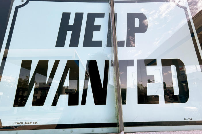 A "Help Wanted" sign is displayed at a gas station in Los Angeles. After surviving the pandemic, small businesses across the country are struggling to find workers