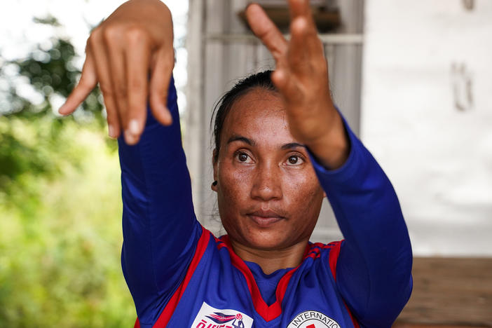 Sinet An, who was born with a disability, is the star of Cambodia's women's wheelchair basketball team, which celebrated their first win in an international tournament just before the pandemic hit. With Cambodia in lockdown, she hones her skills in virtual practice sessions from her home in Chuuok village in Kandal province. Above: a practice session on June 24.
