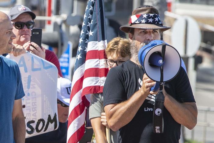 Alan Hostetter, seen here in May 2020, became a leading activist against coronavirus-related lockdown policies in Orange County, Calif. Hostetter, a former police chief and yoga instructor, is now facing conspiracy charges for his alleged role in the insurrection at the U.S. Capitol.