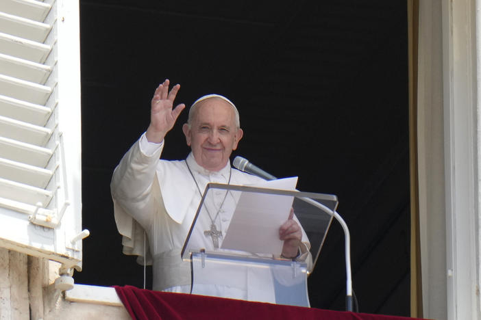 Pope Francis waves to the crowd from the window of his studio overlooking St.Peter's Square, at the Vatican. In a brief announcement Sunday afternoon the Vatican said Pope Francis has gone to a Rome hospital for scheduled surgery.