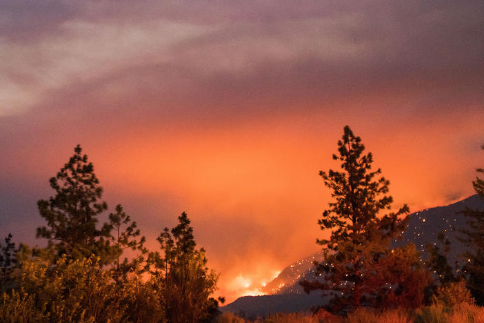 Wildfire burns above the Fraser River Valley near Lytton, British Columbia, Canada, on Friday.