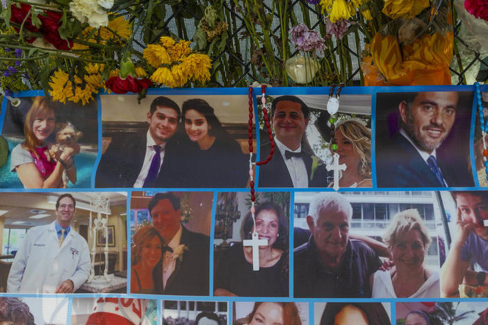 A memorial shows some of the people still missing from the Champlain Towers South condo collapse in Surfside, Fla.