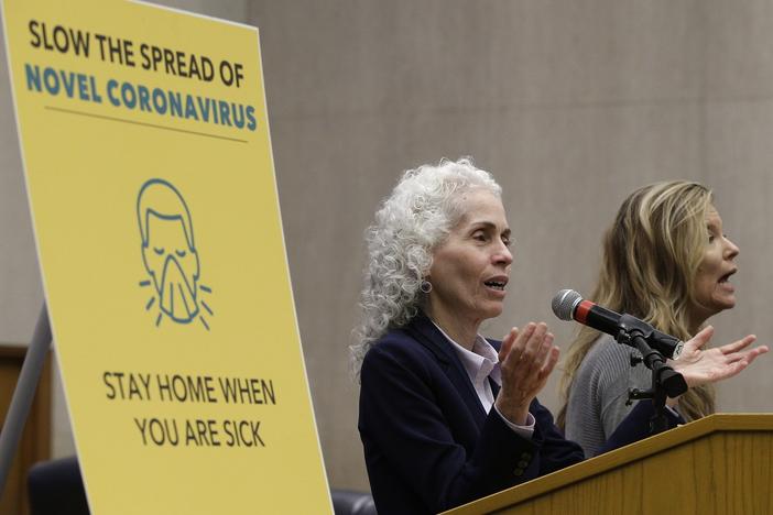 Los Angeles County Public Health Director Barbara Ferrer, left, takes questions at a news conference on March 12, 2020.