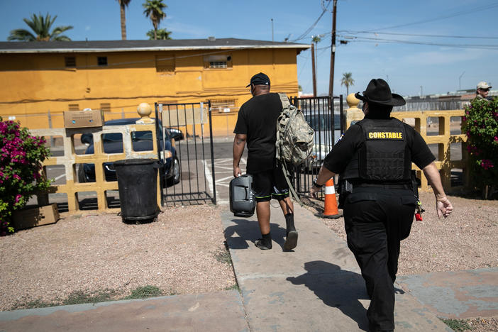 Maricopa County constable Darlene Martinez evicts a tenant on October 7, 2020 in Phoenix, Arizona. Thousands of court-ordered evictions continue nationwide despite a Centers for Disease Control (CDC) moratorium for renters impacted by the coronavirus pandemic.