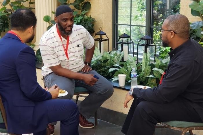 Abdul Muhaymin al-Salim (center), a 49-year-old who was formerly incarcerated on drug charges, works at the Tayba Foundation, where he mentors incarcerated Muslims.